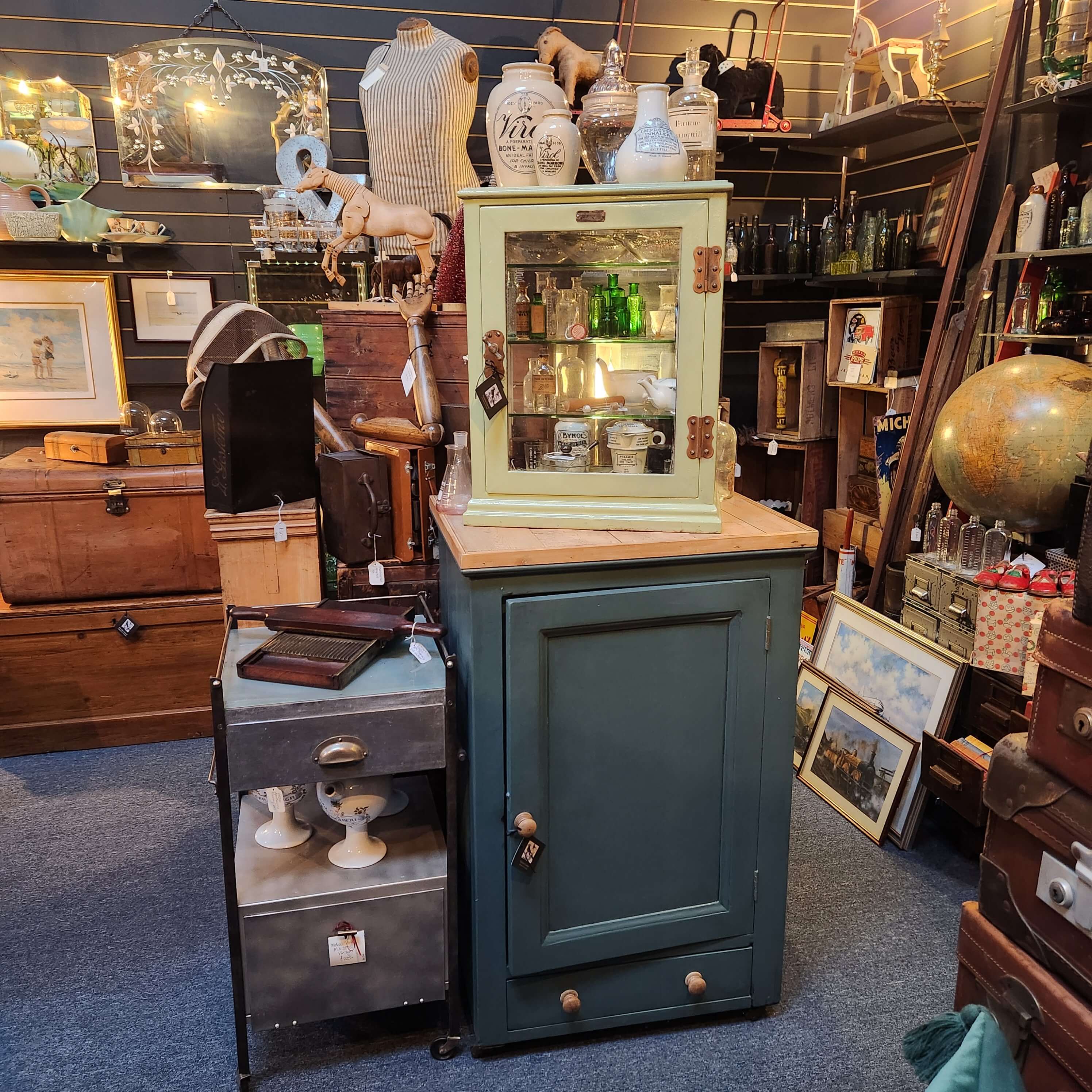 Painted
                Cupboard and Medicine Bottles