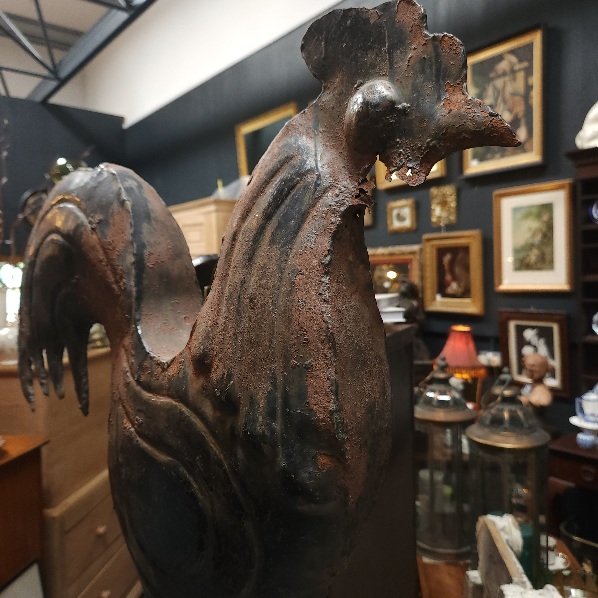 Weathervane
          and view of the interior of Twojays Antiques