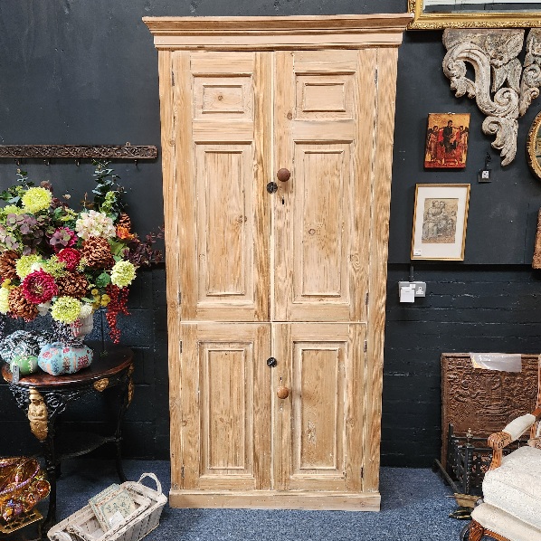 Georgian
                stripped pine housekeepers cupboard showing with doors
                closed